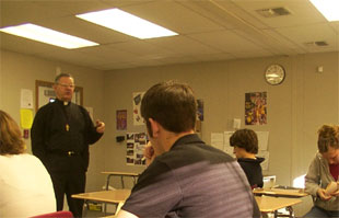 Father Andrew speaks to the class.